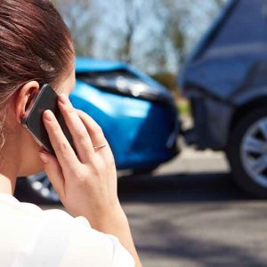 Woman On Phone After Car Accident
